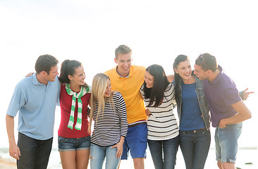 Image showing group of friends having fun on the beach