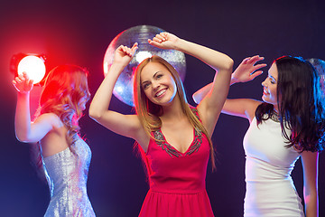 Image showing three smiling women dancing in the club