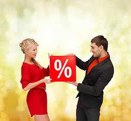 Image showing smiling woman and man with red percent sale sign