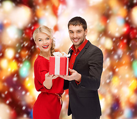 Image showing smiling woman and man with gift box