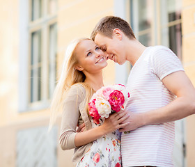 Image showing couple with flowers in the city