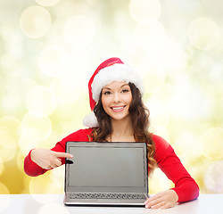 Image showing woman in santa helper hat with laptop computer