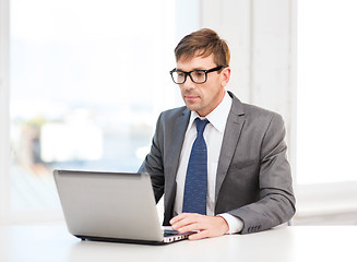 Image showing businessman working with laptop computer