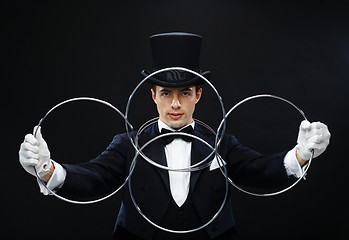 Image showing magician showing trick with linking rings