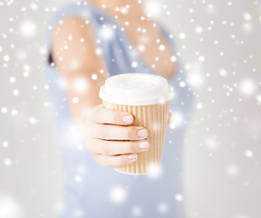 Image showing woman hand holding take away coffee cup