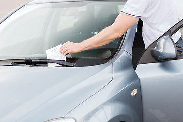 Image showing parking ticket on car windscreen