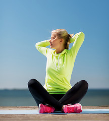 Image showing woman doing yoga outdoors