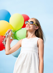 Image showing happy girl with colorful balloons