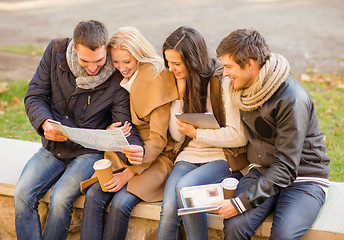 Image showing couples with tourist map in autumn park