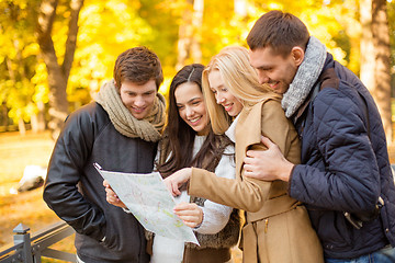 Image showing couples with tourist map in autumn park