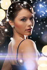 Image showing woman in evening dress wearing diamond earrings