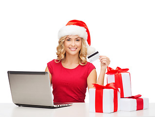 Image showing woman with gifts, laptop computer and credit card