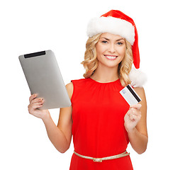 Image showing woman with tablet pc and credit card