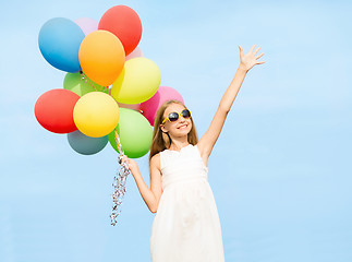 Image showing happy girl with colorful balloons