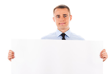 Image showing businessman holding white placard