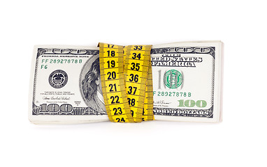 Image showing Dollar banknote and measure tape