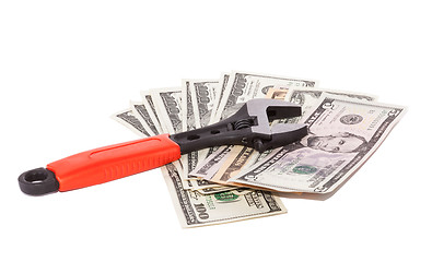 Image showing Wrench and bills of dollars