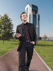 Image showing Businessman working near office ad