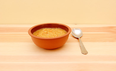 Image showing Bowl of vegetable soup with a spoon 