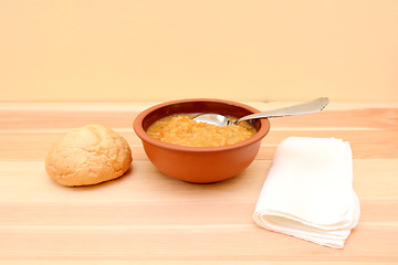 Image showing Bowl of lentil soup with a bread roll