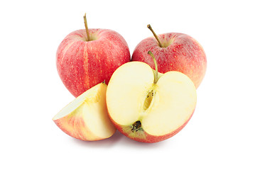 Image showing Two red apples, half and a slice