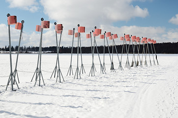 Image showing empty boat park on the lake in winter 