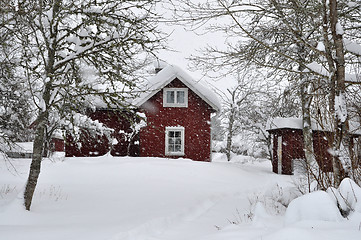 Image showing Red house in snowfall