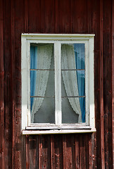 Image showing Old window with curtains, typical Swedish style 