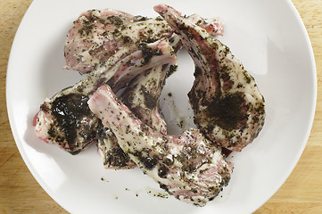 Image showing marinading lamb chops from above