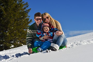 Image showing family having fun on fresh snow at winter vacation