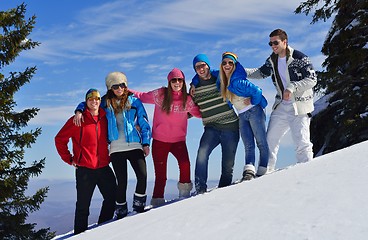 Image showing friends have fun at winter on fresh snow