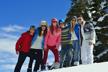 Image showing friends have fun at winter on fresh snow