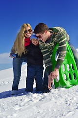 Image showing family having fun on fresh snow at winter vacation