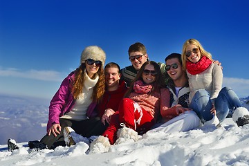 Image showing friends have fun at winter on fresh snow