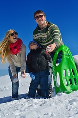 Image showing family having fun on fresh snow at winter vacation