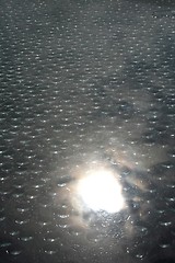 Image showing Drops on window with reflecting sun