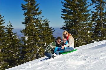 Image showing family having fun on fresh snow at winter vacation