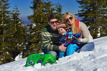 Image showing family having fun on fresh snow at winter vacation