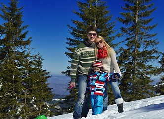 Image showing family having fun on fresh snow at winter vacation