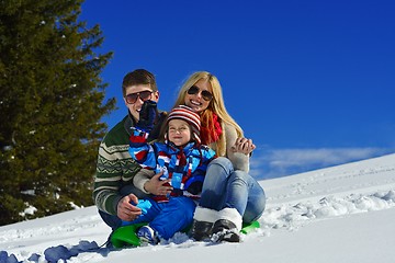 Image showing family having fun on fresh snow at winter vacation