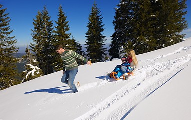 Image showing family having fun on fresh snow at winter vacation