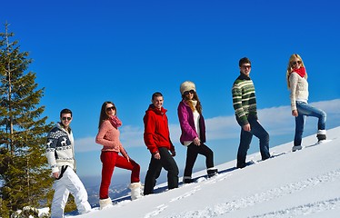 Image showing friends have fun at winter on fresh snow