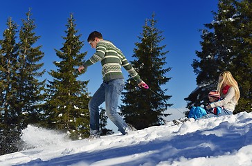 Image showing family having fun on fresh snow at winter vacation