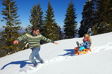 Image showing family having fun on fresh snow at winter vacation