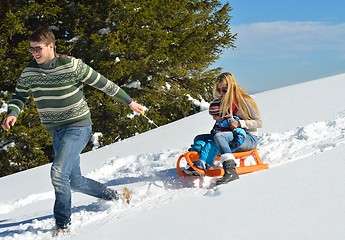 Image showing family having fun on fresh snow at winter vacation