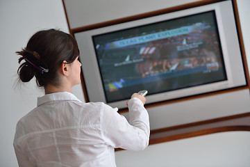 Image showing happy young woman relax at home on sofa