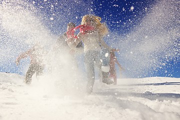 Image showing friends have fun at winter on fresh snow