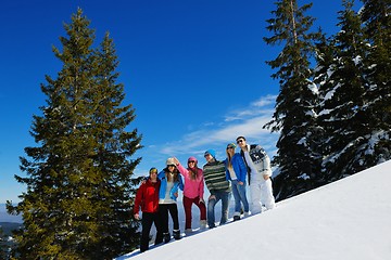 Image showing friends have fun at winter on fresh snow