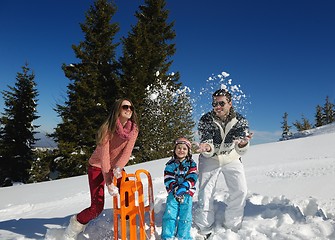 Image showing family having fun on fresh snow at winter vacation