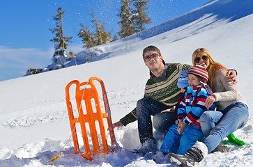 Image showing family having fun on fresh snow at winter vacation